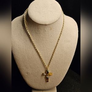 Vintage gemstone cross on gold tone chain. 18" chain. 2" cross